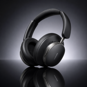 UGREEN Studio Pro ANC Wireless Headphones Black displayed on a reflective dark surface with premium studio lighting, showcasing its sleek over-ear design and luxury finish.