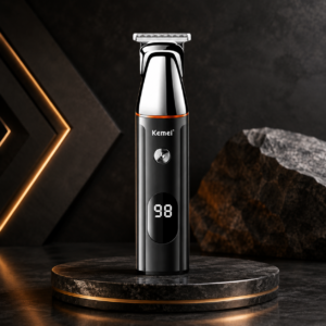 Kemei KM-5857 Professional 4-in-1 Rechargeable Grooming Kit with LED Display featuring a premium stainless steel T-blade trimmer on a luxury dark studio background.