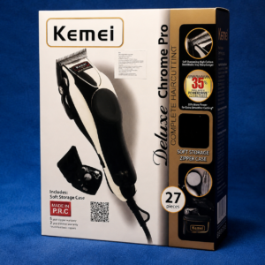 Kemei KM-8825 Deluxe Chrome Pro Hair Cutting Kit retail box with 27-piece grooming accessories and self-sharpening high carbon steel blade features.